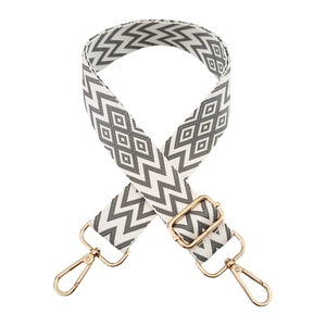 Adjustable wide woven shoulder strap with grey geometric pattern and gold buckles