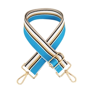 Detail of adjustable wide striped shoulder strap with high-quality gold metal hooks