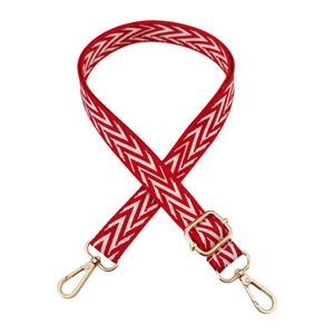 Adjustable chevron patterned strap with gold metal hardware for shoulder bags