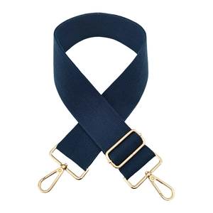 Detail of dark blue cotton bag strap with golden metal swivel hooks and adjuster