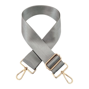 Detail of adjustable silver nylon shoulder strap with rose gold metal lobster clasps