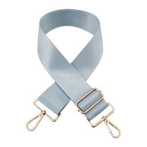 Detail of adjustable 5cm light blue nylon bag strap with gold metal swivel hooks