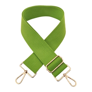 Detail of green 5cm wide cotton bag strap with adjustable gold metal buckle and lobster hooks