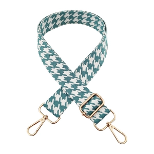 Detail of 3.8cm houndstooth shoulder strap with adjustable light gold metal buckles