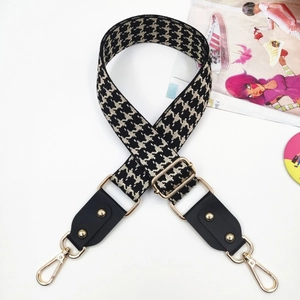 Adjustable houndstooth woven wide shoulder strap with leather ends and gold metal buckles