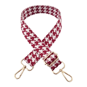 Detail of 3.8cm houndstooth shoulder strap with gold metal swivel hooks and adjuster