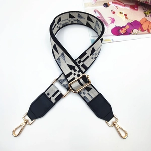 Adjustable woven wide shoulder strap with beige black geometric pattern and gold clips