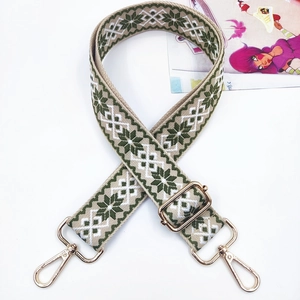 Adjustable bohemian style wide bag strap with green snowflake weave and gold hardware