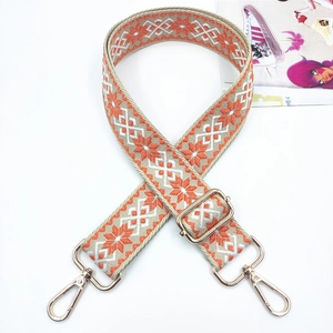 Ethnic style embroidered bag strap in orange and white with golden metal swivel hooks