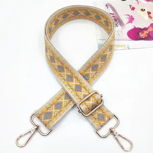 Ethnic embroidered bag strap with yellow geometric patterns and gold metal swivel hooks