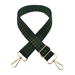 Detail of adjustable dark green woven shoulder strap with gold metal buckles and hooks