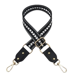 Ethnic wide bag strap with black white geometric arrow patterns and gold buckles