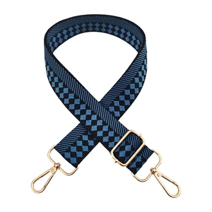 Detail of blue checkerboard jacquard wide strap with gold polished metal lobster clasps