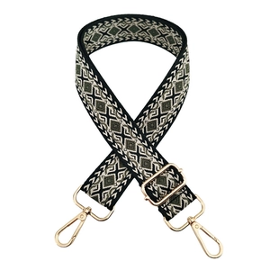 Detail of bohemian geometric jacquard bag strap with adjustable gold lobster clasps