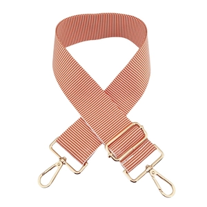 Close-up of 5cm striped orange and white adjustable canvas shoulder strap with gold hooks