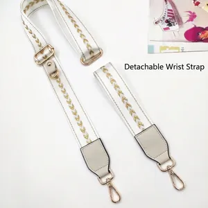 Crossbody phone strap set with white webbing and gold V-embroidery patterns