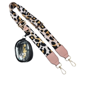 Adjustable leopard print crossbody phone strap with a round pouch and pink leather accents