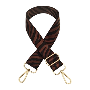 Adjustable zebra print bag strap with gold lobster clasps and brown animal pattern