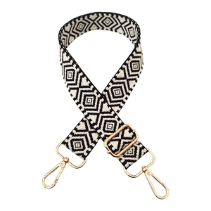 Adjustable wide guitar bag strap with black and white diamond pattern and gold hardware