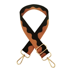 Detail of adjustable 3.8cm wave patterned canvas bag strap with gold metal lobster clasps