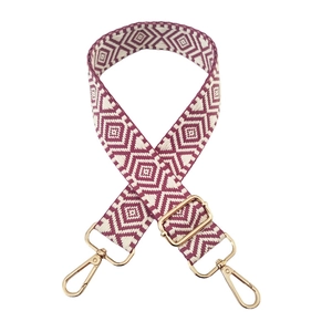 Close-up of geometric diamond pattern strap with polished gold-tone lobster clasps