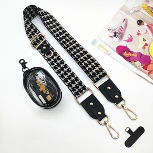 Universal crossbody phone strap with houndstooth pattern, gold buckle, and clear pouch