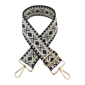 Detail of 5cm ethnic geometric strap with gold metal hooks and adjustable buckle