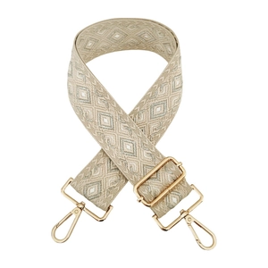 Detail of 5cm wide jacquard strap with silver diamond pattern and gold metal hooks