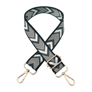 Adjustable wide replacement bag strap with black and white geometric wave pattern and gold hooks
