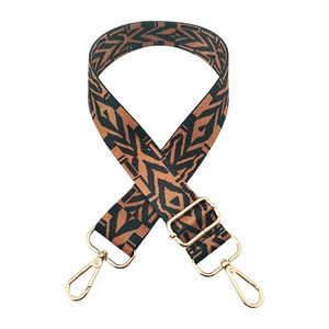 Detail of adjustable wide woven guitar style shoulder strap with ethnic geometric pattern