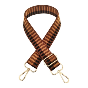 Adjustable brown and black striped woven strap with gold metal hooks and buckle