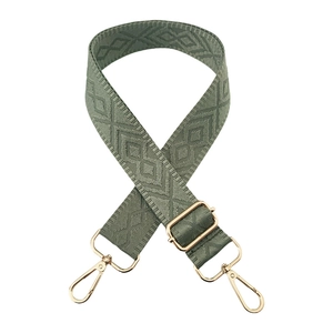 Detail of army green woven 3.8cm wide strap with diamond pattern and gold metal hardware