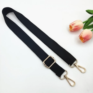 Adjustable black cotton canvas strap with gold metal hooks for crossbody bags