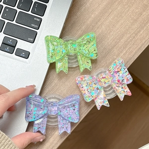 Bow-shaped glitter phone grip socket stand with heart sequins for mobile phones