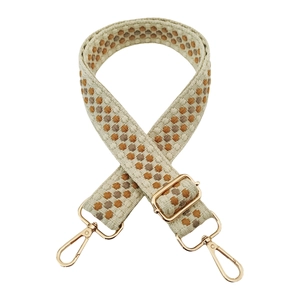 Detail of adjustable thick woven shoulder strap with orange and brown dot embroidery