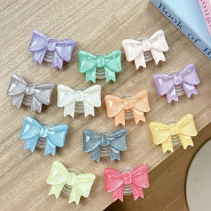 Set di 12 supporti per telefono glitterati a forma di fiocco in colori vivaci