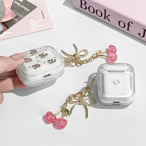 Sparkling pink cherry glitter Case for AirPods featuring golden bow and cherry pendants