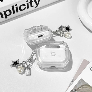 Close-up of glittery AirPods case with silver star and white pearl charm accessory
