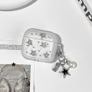 Detail of glitter AirPods case with silver stars and premium pearl charm accessory