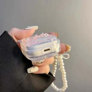 Detail of pink crystal case for AirPods with pearl strap and bottom charging port cutout