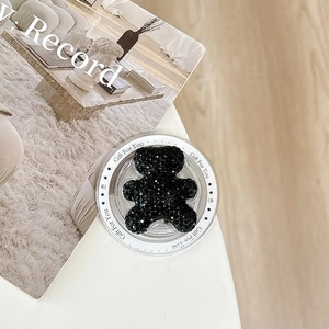 Close-up of bear phone socket with black rhinestones and Gift For You text detail