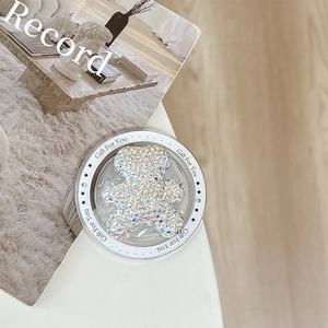 Close-up of a sparkling rhinestone bear phone grip with Gift For You printed base