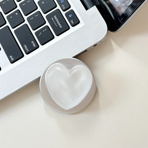Detail of white 3D heart phone grip with pearl finish and silver collapsible base