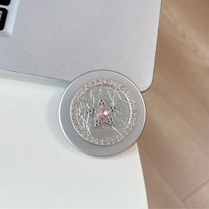 Detail of silver magnetic phone grip with pink star gemstone and rhinestone inlay