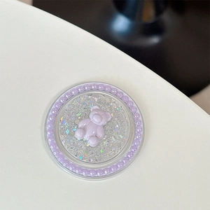 Détail du support téléphone ours à paillettes avec perles mauves et étoiles