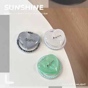 Glitter heart-shaped MagSafe phone grip set in silver, white and mint green colors