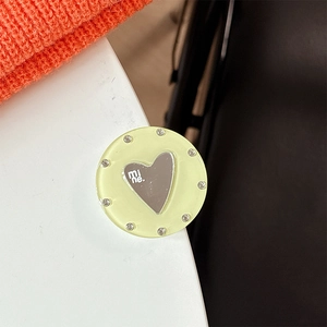 Detail of mint green heart mirror phone grip with sparkles and 'mine.' text