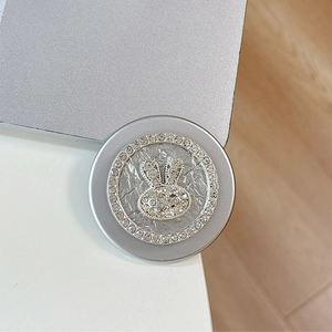 Detail of a sparkling diamond-encrusted rabbit magnetic phone grip with silver finish
