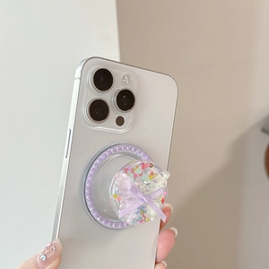 Pastel bow magnetic phone grip with glitter hearts and pearl trim on white phone