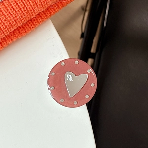 Close-up of heart mirror phone grip with mine text and pink beaded edge design